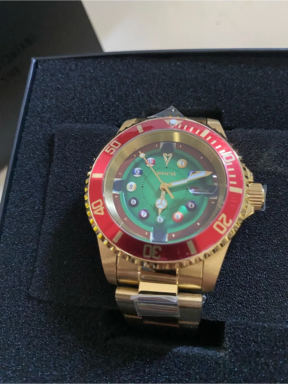Invicta Gold Watch with Green Dial and Red Bezel